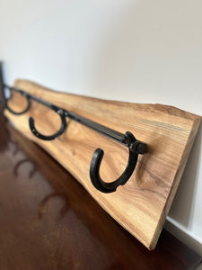 Horse shoe coat hanger